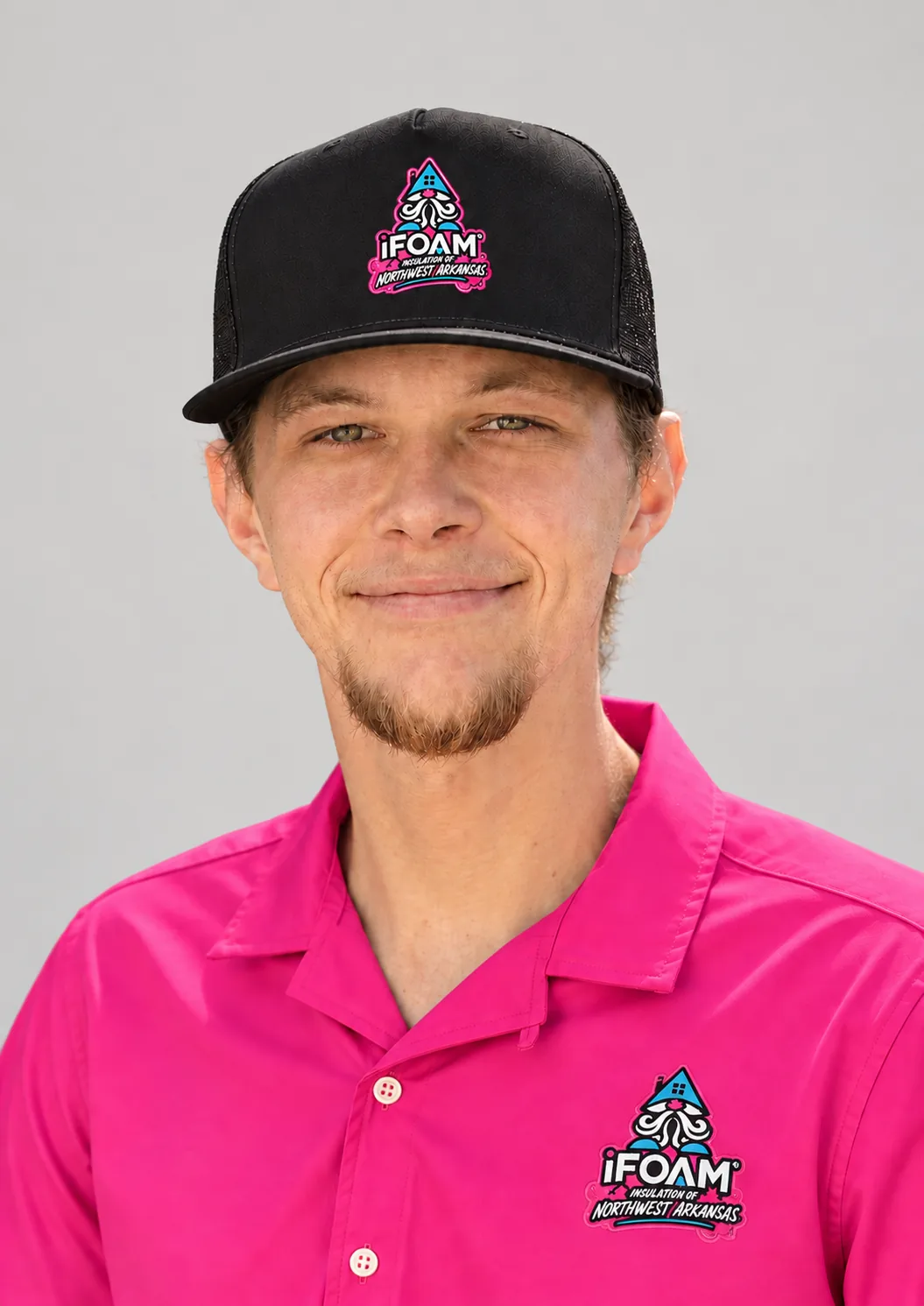 An iFOAM of Northwest Arkansas installer in branded uniform