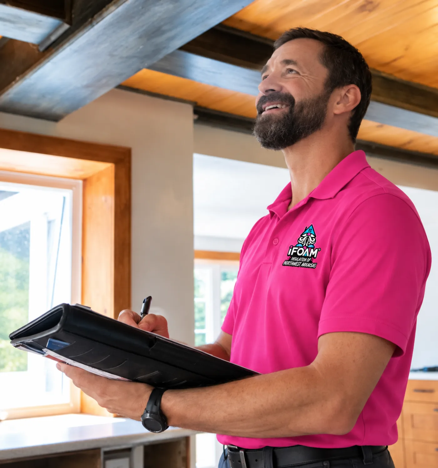 An iFOAM of Northwest Arkansas estimator on site with a clipboard